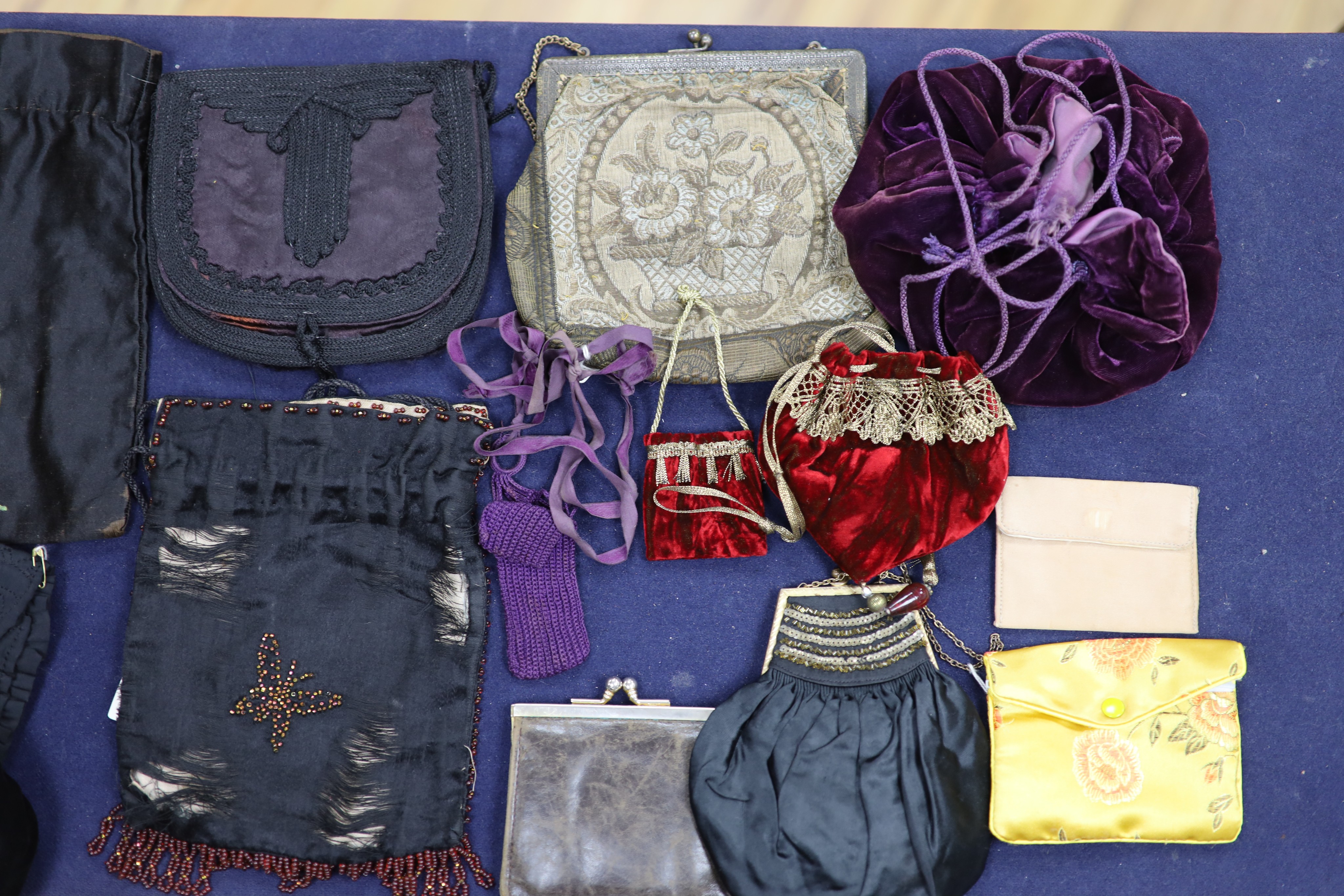 A collection of approximately fifty Victorian and later beadwork, white metal and fabric purses etc.